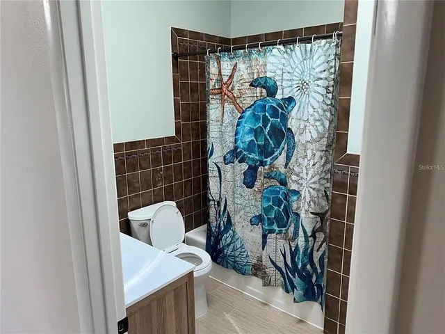 a bathroom with a sink a mirror and a vanity