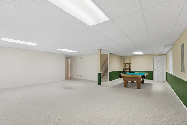 an empty room with furniture and a table