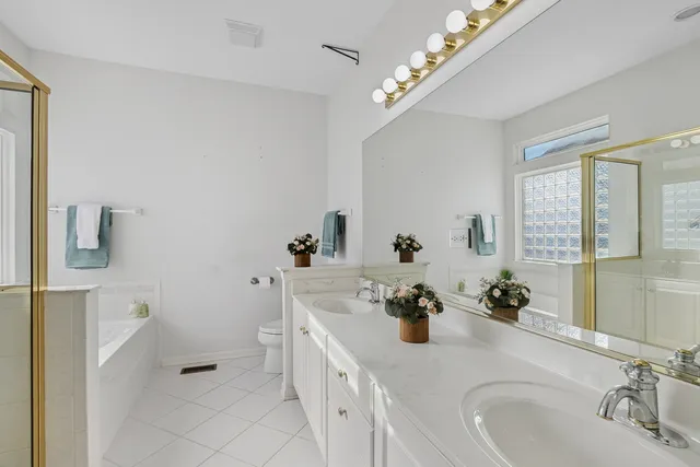 a bathroom with a sink a vanity and mirror