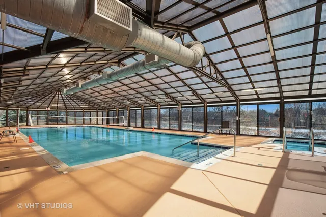 a view of a swimming pool with a outdoor seating