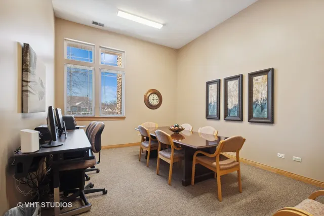 a dining room with furniture and window