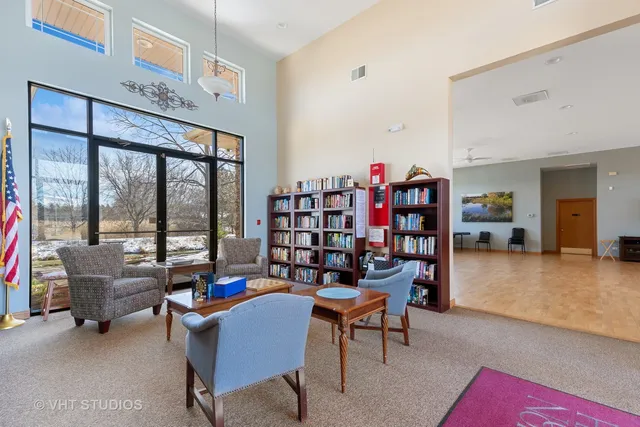 a dining room with furniture and a book shelf