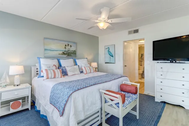 a bathroom with a shower a toilet and a sink