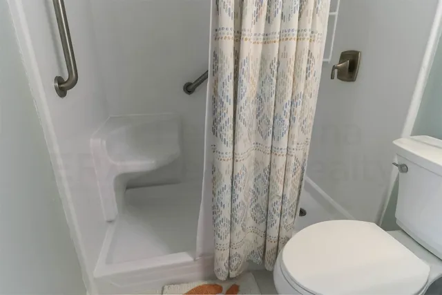 a bedroom with two beds and a window