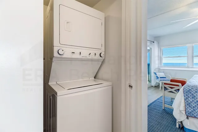 a view of a two chairs in the balcony