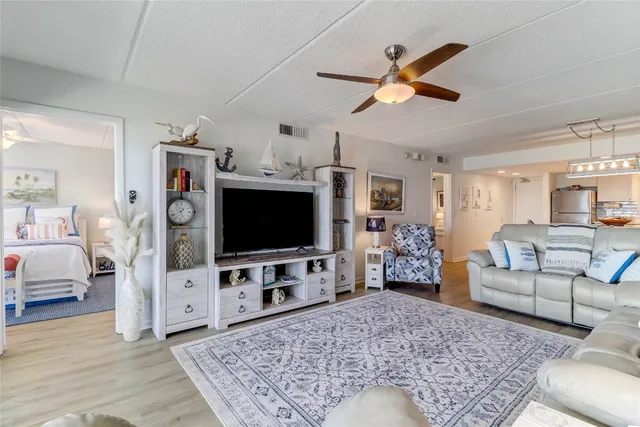 a living room with furniture and a rug