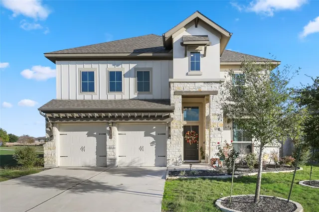 front view of a house with a yard