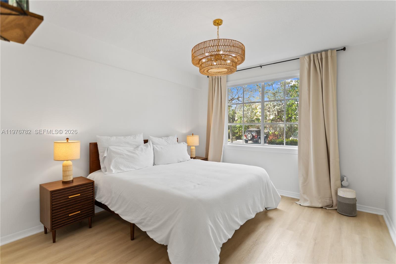 6851 Southwest 44th Street, Unit 107 Miami, FL 33155 - Photo 18 of 41 a bedroom with a bed and a window