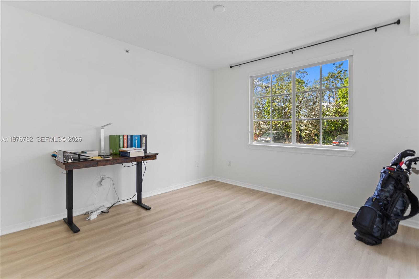 6851 Southwest 44th Street, Unit 107 Miami, FL 33155 - Photo 26 of 41 a room with furniture and a window