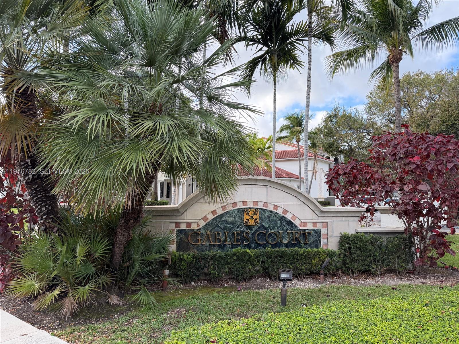 6851 Southwest 44th Street, Unit 107 Miami, FL 33155 - Photo 36 of 41 a front view of multi story residential apartment building with yard and green space