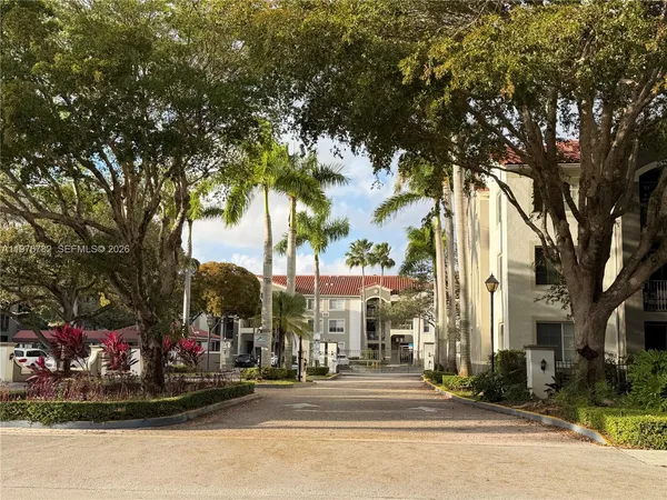 a city street lined with buildings and trees