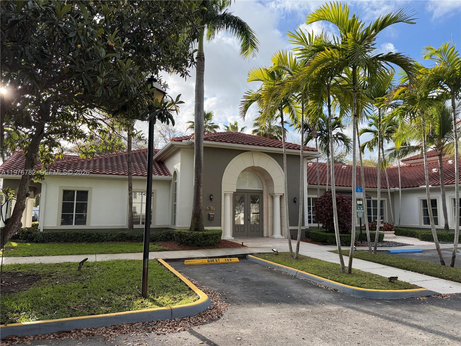 6851 Southwest 44th Street, Unit 107 Miami, FL 33155 - Photo 41 of 41 a front view of a house with garden