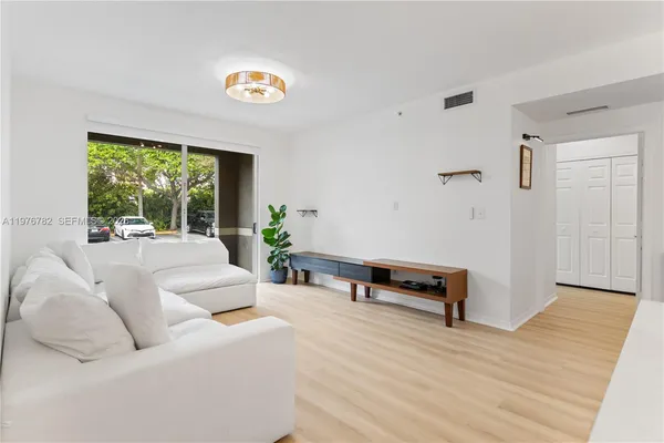 a living room with furniture and a window