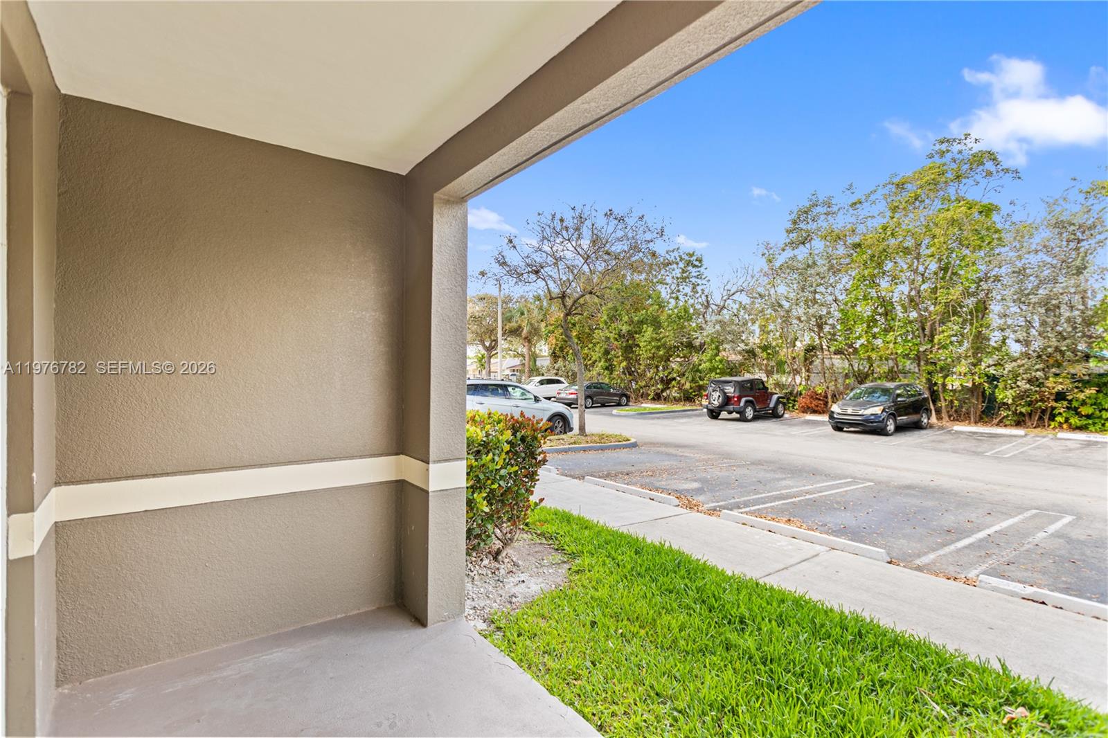 6851 Southwest 44th Street, Unit 107 Miami, FL 33155 - Photo 7 of 41 a view of a patio with a table and chairs and potted plants