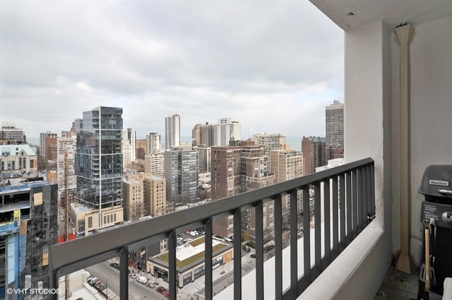 1030 North State Street, Unit 20D Chicago, IL 60610 - Photo 5 of 22 a view of a city skyline from a balcony
