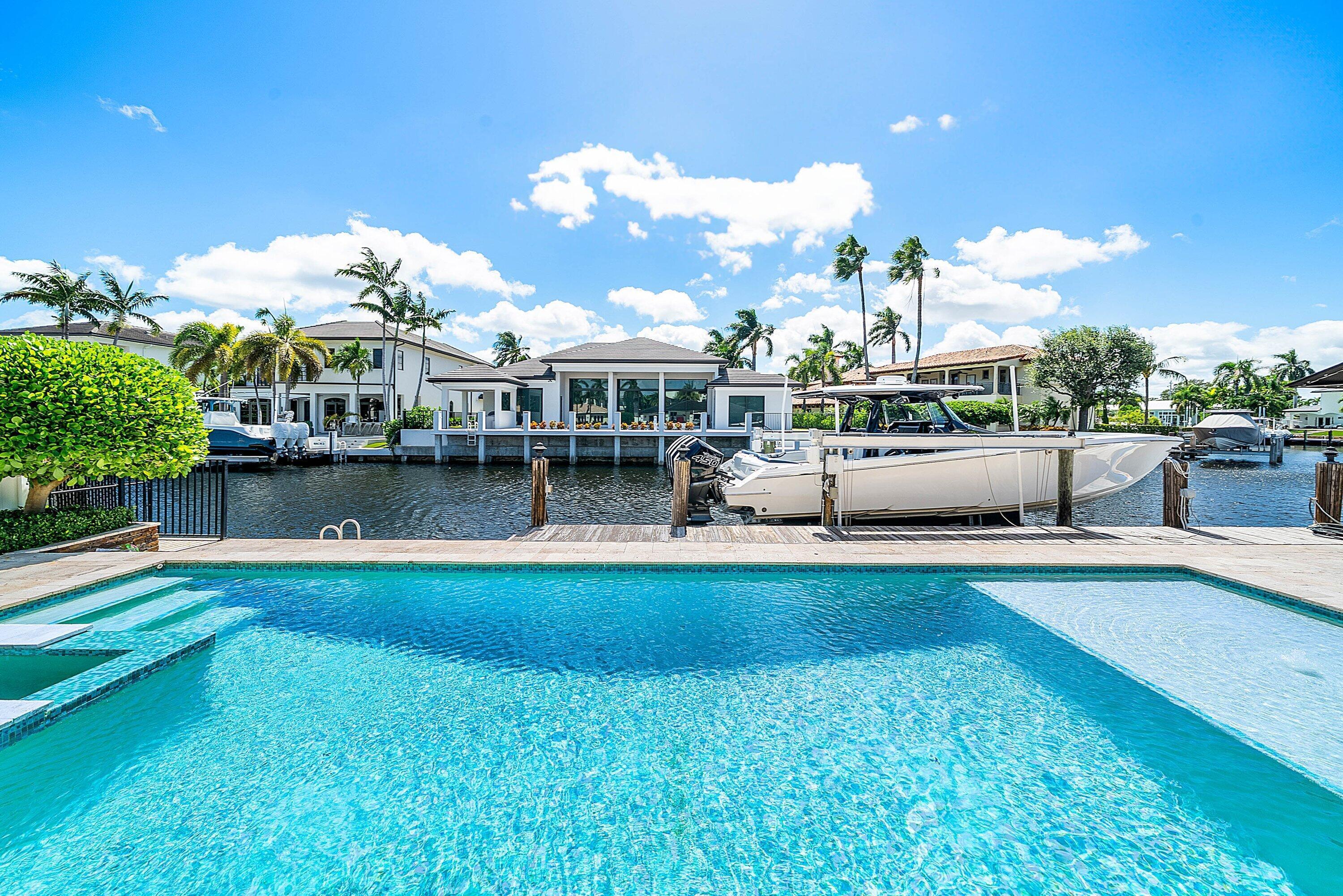 740 Northeast 36th Street Boca Raton, FL 33431 - Photo 20 of 43 a view of a house with swimming pool and sitting area
