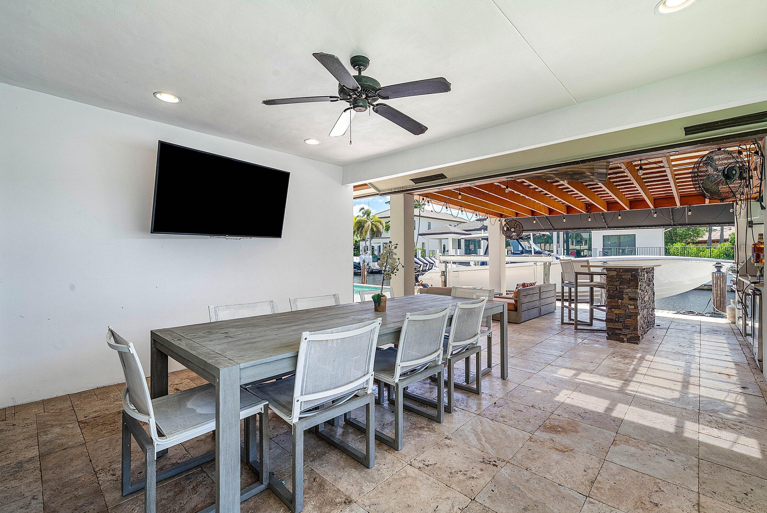 740 Northeast 36th Street Boca Raton, FL 33431 - Photo 30 of 43 a view of a livingroom and a dining room with furniture and a window