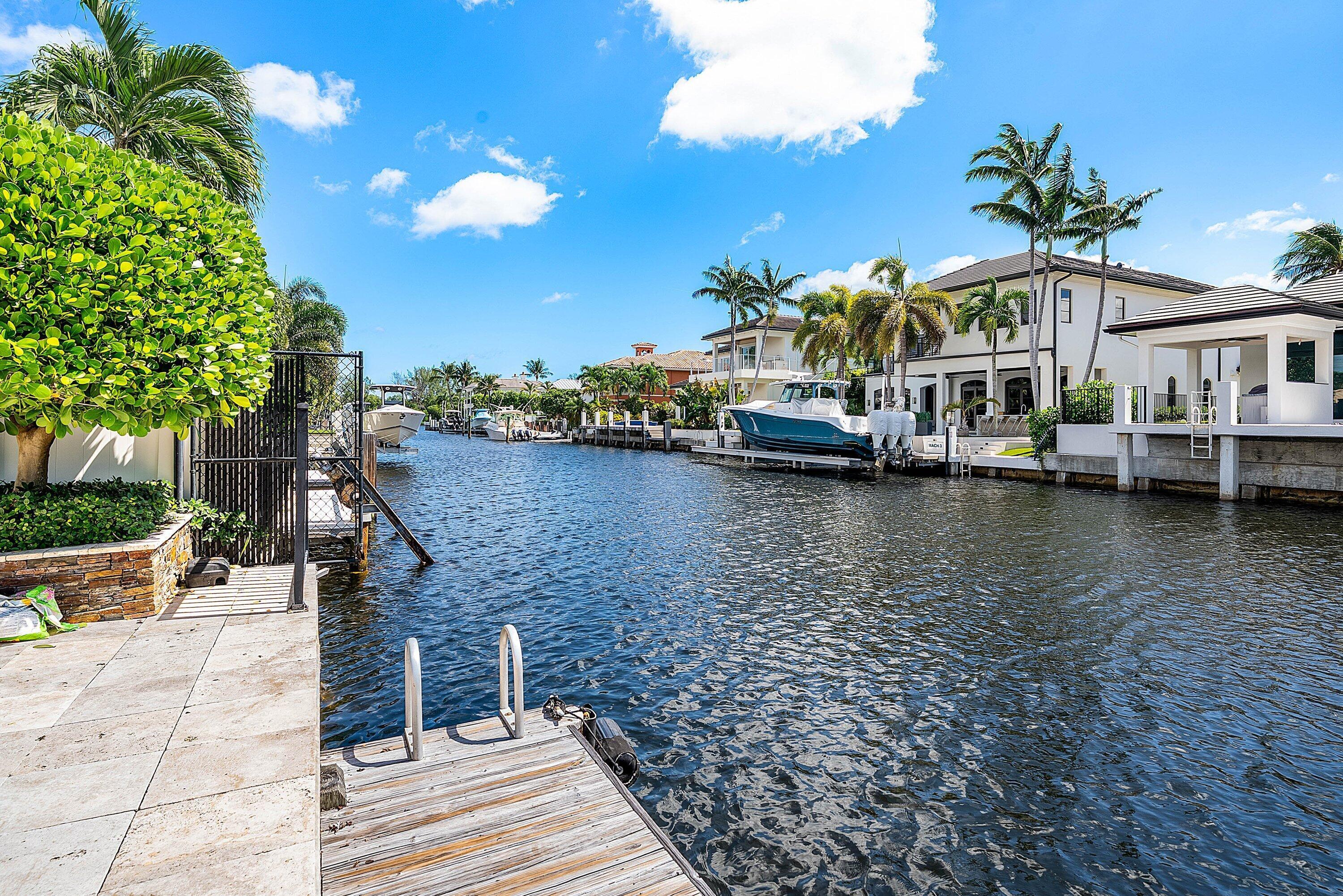 740 Northeast 36th Street Boca Raton, FL 33431 - Photo 32 of 43 a view of a lake with a building in the background