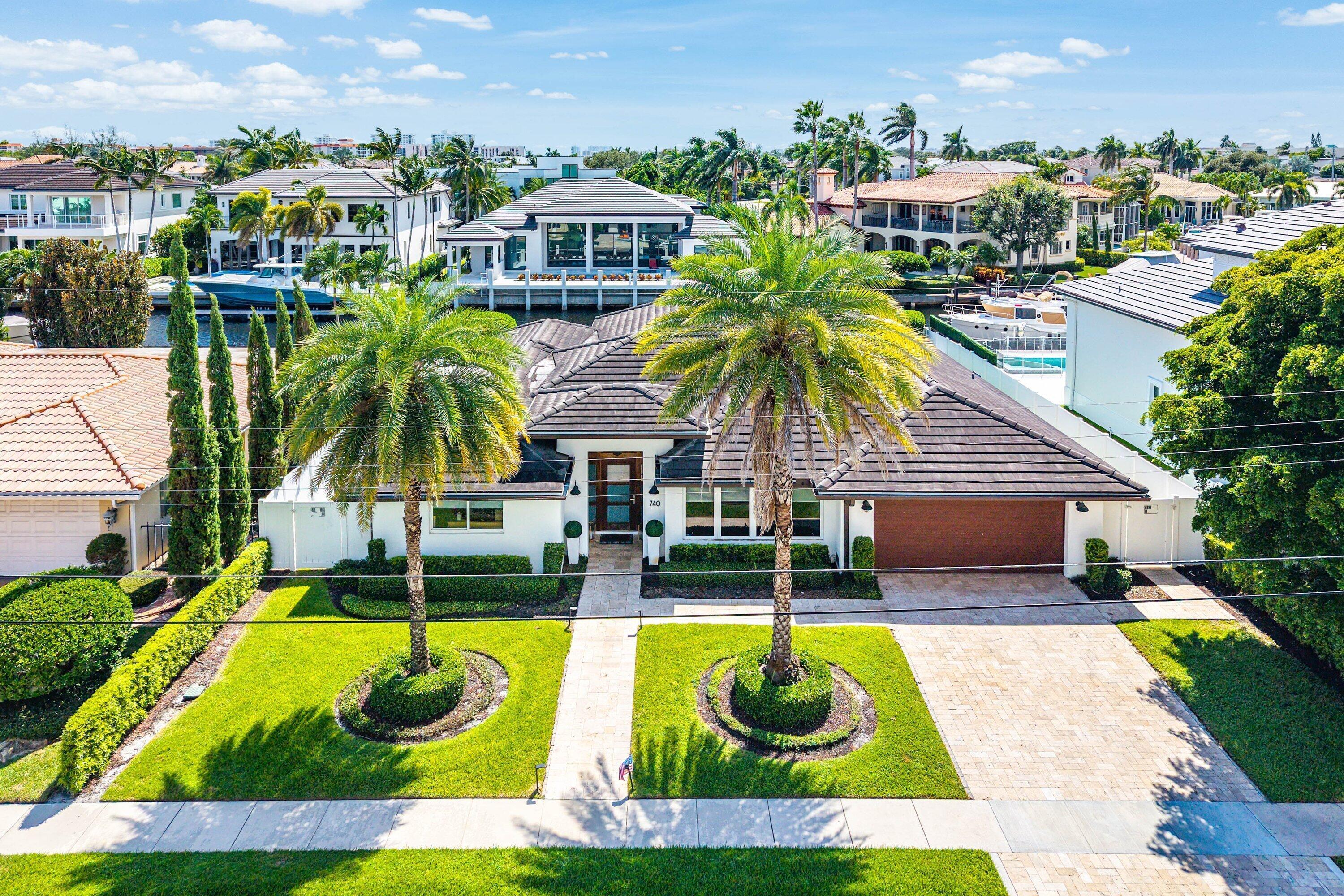 740 Northeast 36th Street Boca Raton, FL 33431 - Photo 33 of 43 a view of a house with swimming pool and sitting area