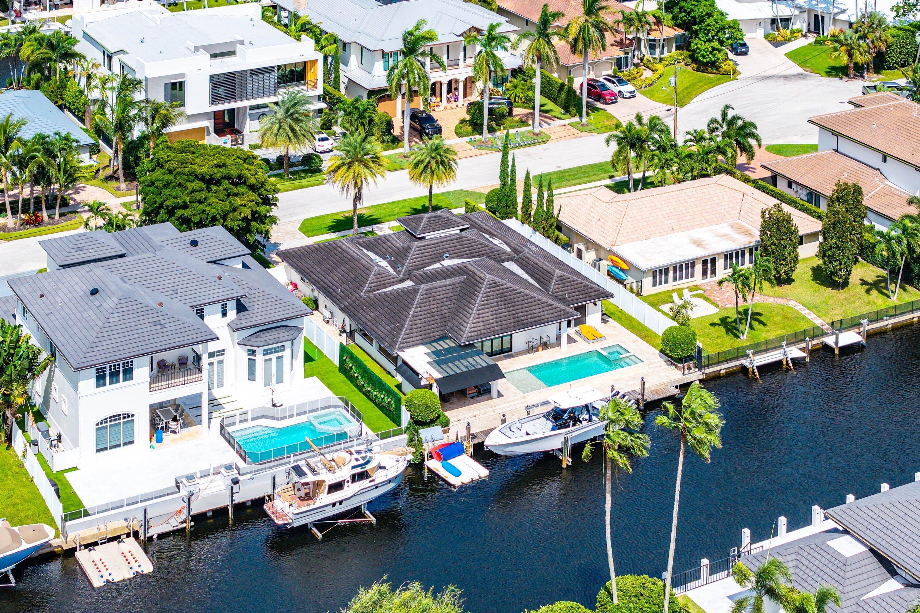 740 Northeast 36th Street Boca Raton, FL 33431 - Photo 38 of 43 a aerial view of a swimming pool with outdoor seating