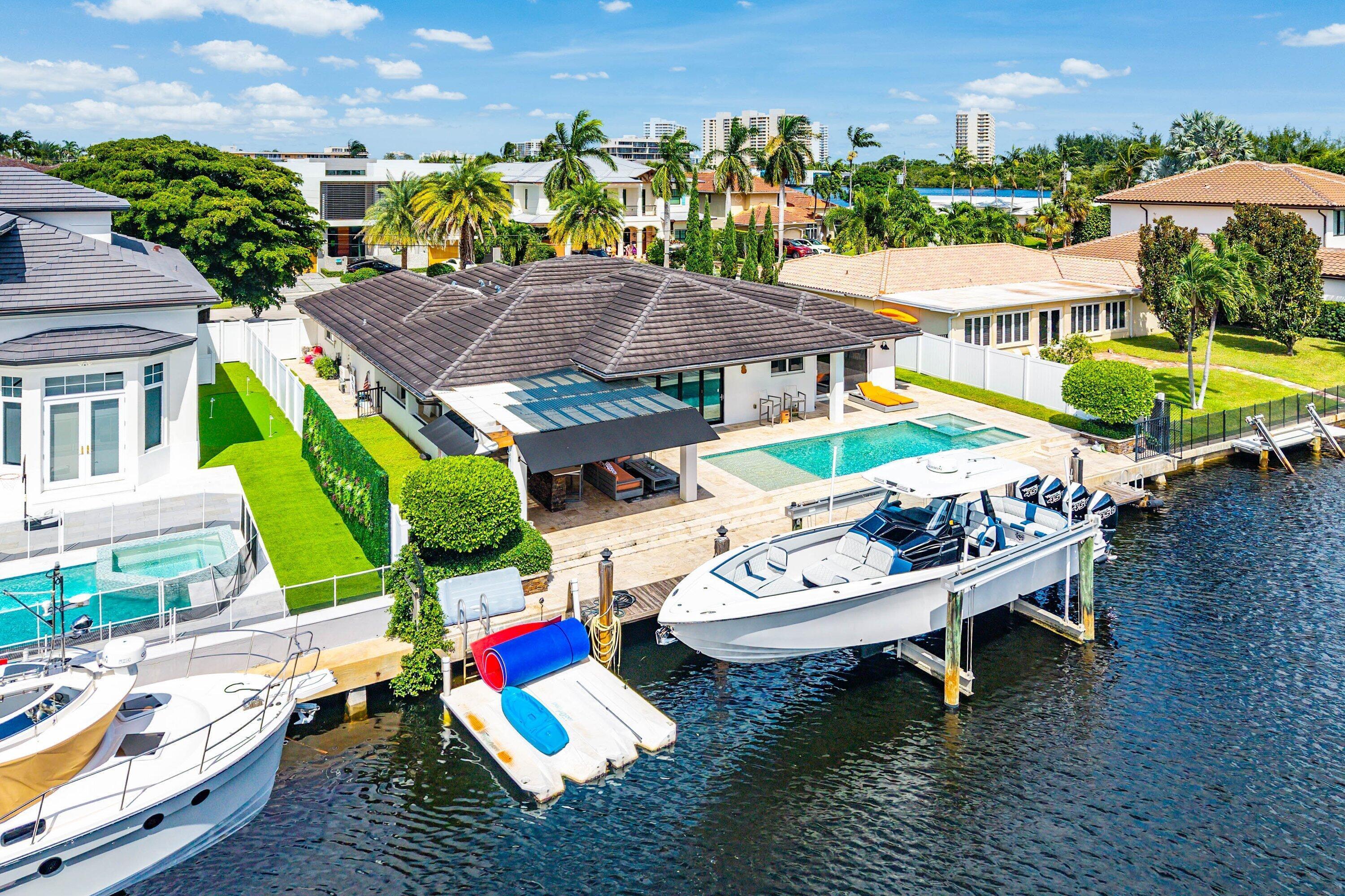 740 Northeast 36th Street Boca Raton, FL 33431 - Photo 40 of 43 an aerial view of a house with swimming pool and outdoor seating