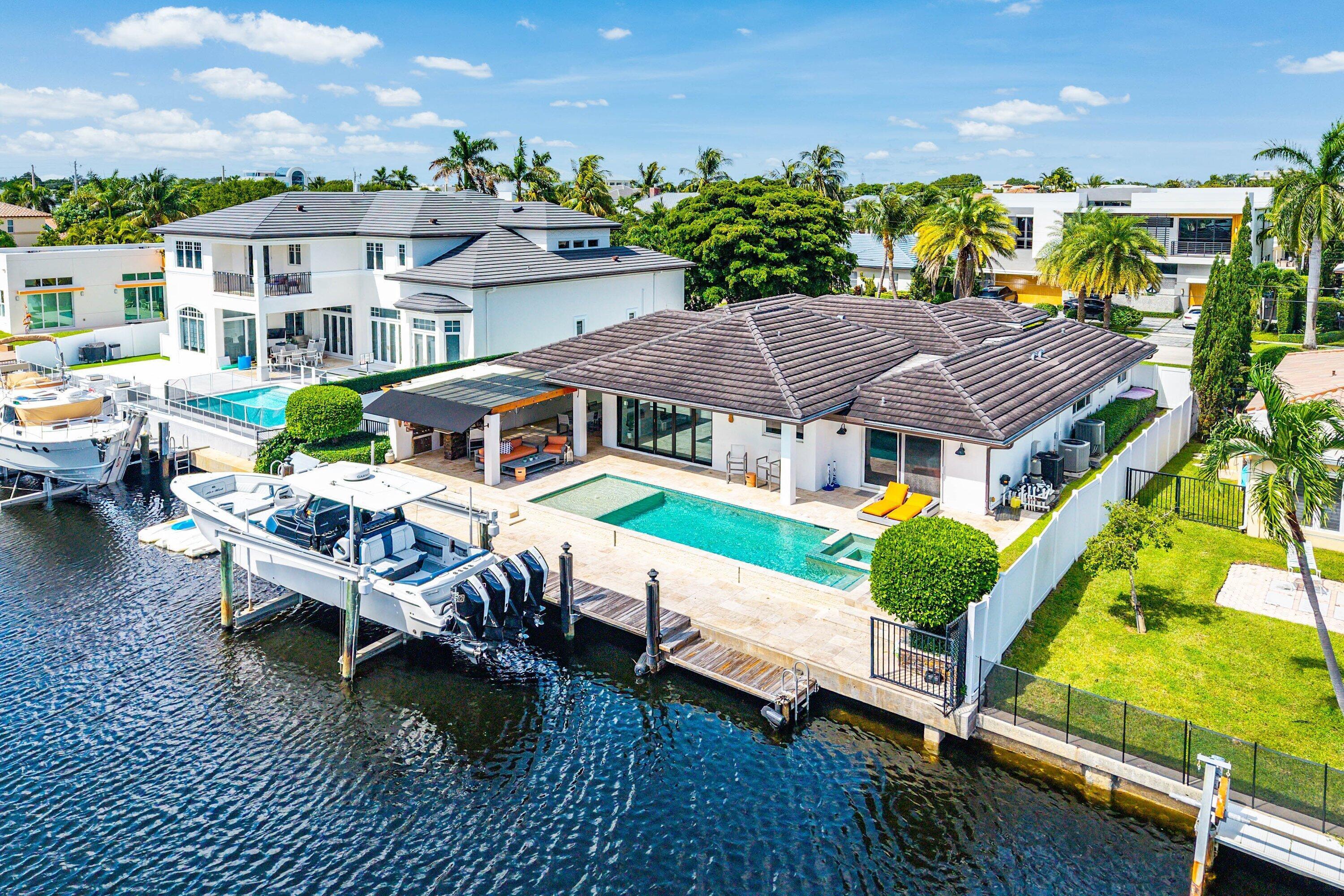740 Northeast 36th Street Boca Raton, FL 33431 - Photo 41 of 43 a aerial view of a house with swimming pool and sitting area