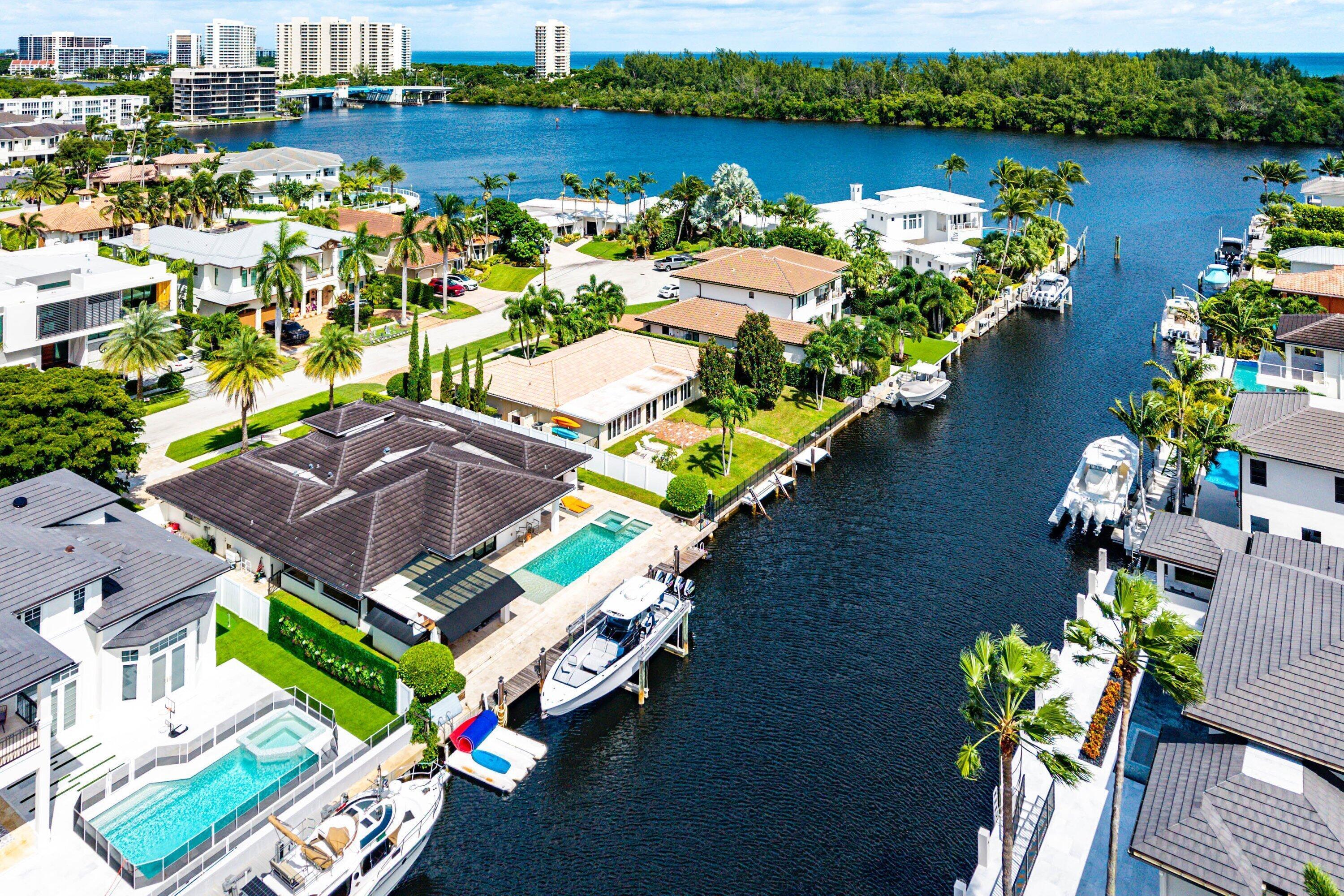 740 Northeast 36th Street Boca Raton, FL 33431 - Photo 42 of 43 an aerial view of a house with outdoor space and a lake view