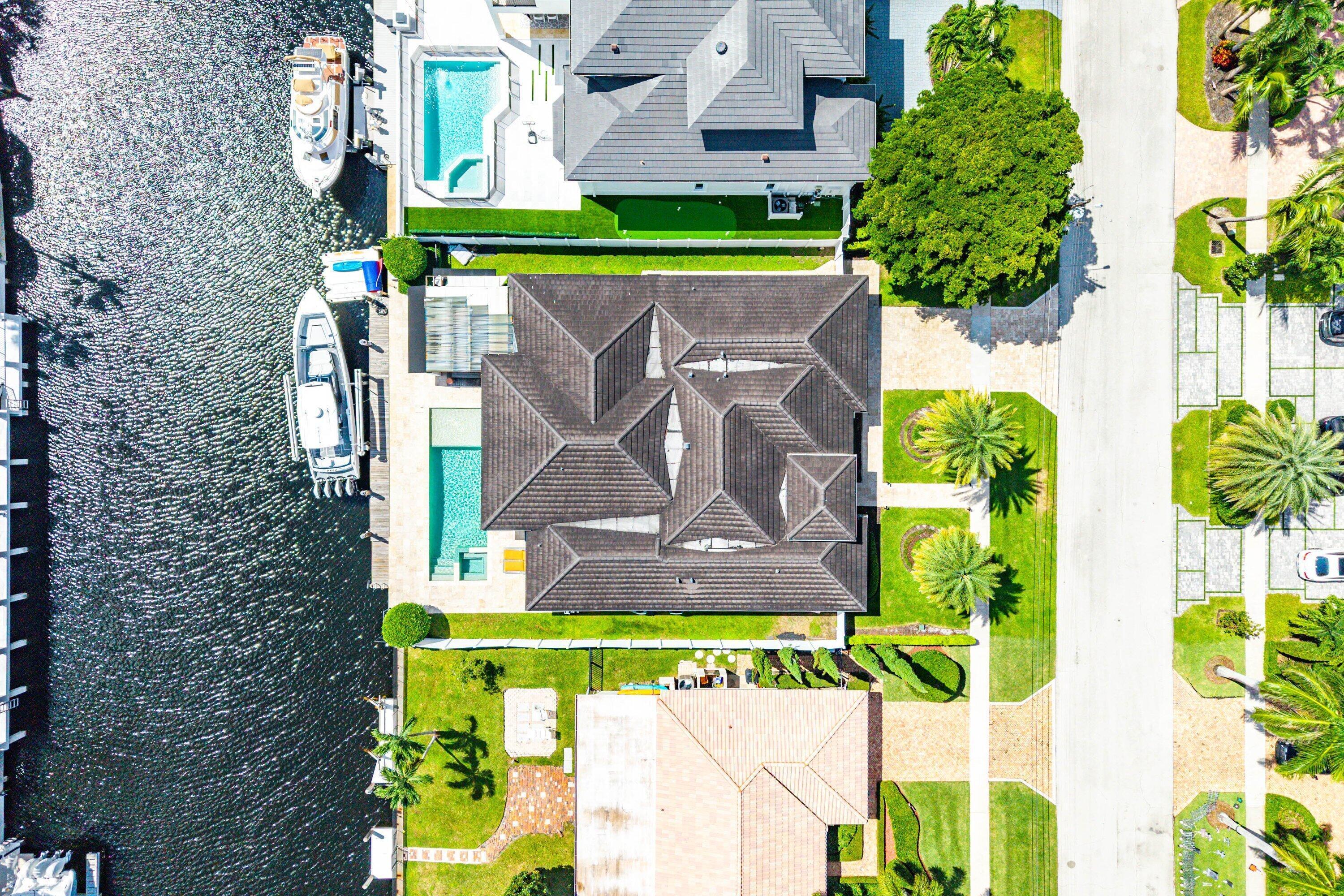 740 Northeast 36th Street Boca Raton, FL 33431 - Photo 43 of 43 an aerial view of a house with a yard swimming pool and outdoor seating