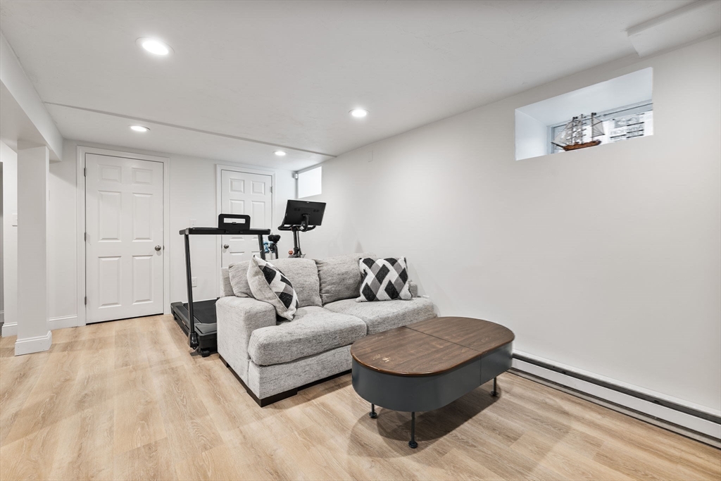 424 Brook Road Milton, MA 02186 - Photo 29 of 41 a living room with furniture and a table