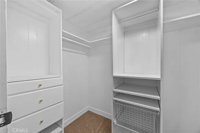 a view of an empty walk in closet