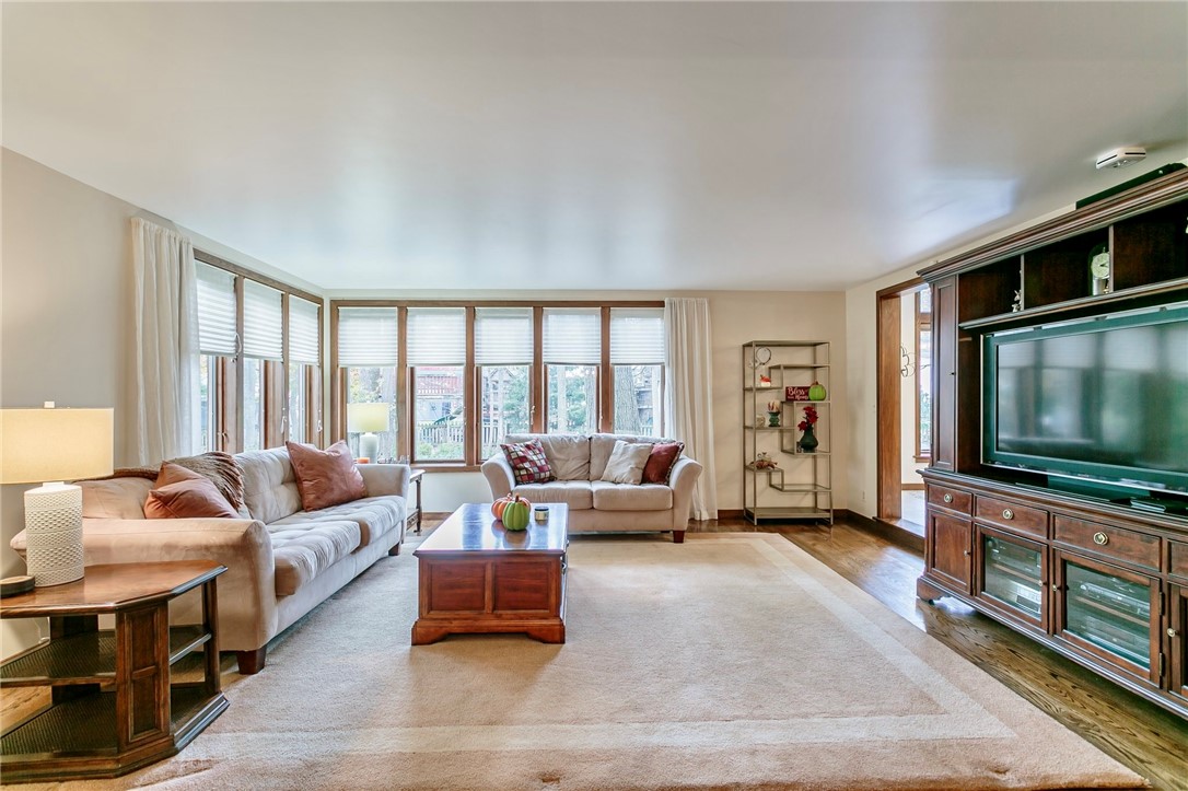 20 Fairfield Drive Perinton, NY 14450 - Photo 12 of 49 Large Family Room with wall of windows overlooking