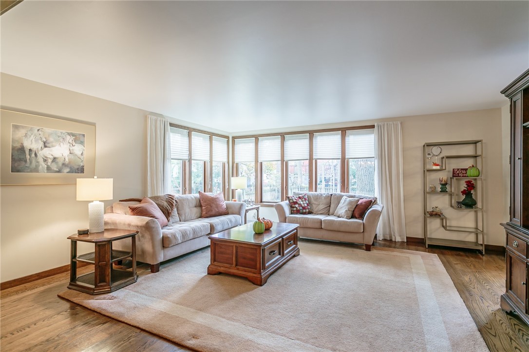 20 Fairfield Drive Perinton, NY 14450 - Photo 13 of 49 Large Family Room with wall of windows overlooking