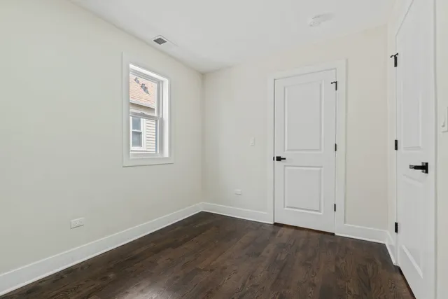 a kitchen with a stove a refrigerator and a sink