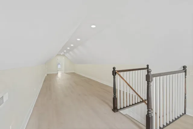 a view of a hallway with staircase