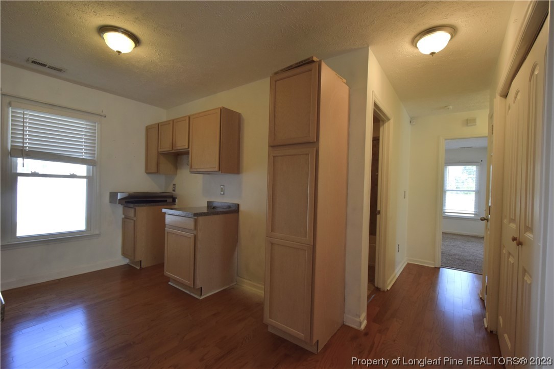 512 Kernstown Road Raeford, NC 28376 - Photo 12 of 25 a view of kitchen with furniture and wooden floor