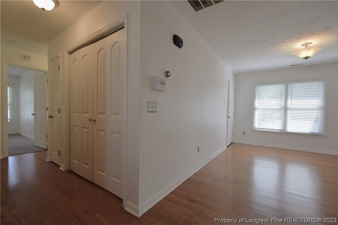 512 Kernstown Road Raeford, NC 28376 - Photo 13 of 25 an empty room with wooden floor and windows