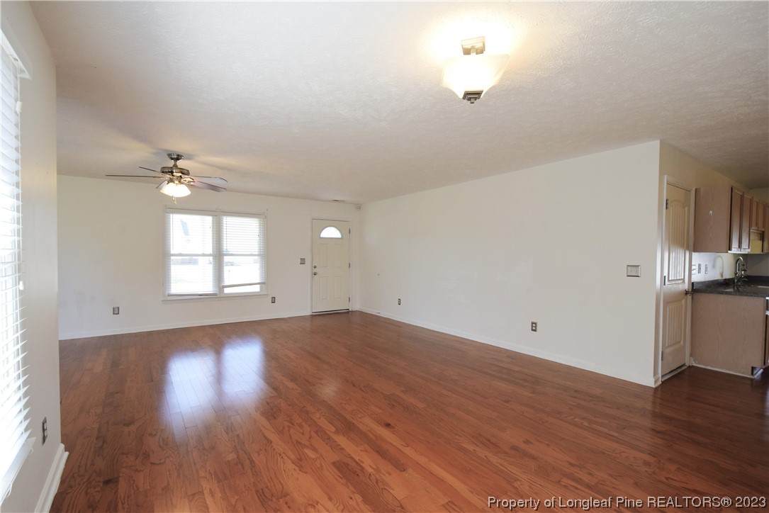 512 Kernstown Road Raeford, NC 28376 - Photo 14 of 25 wooden floor in an empty room with a window