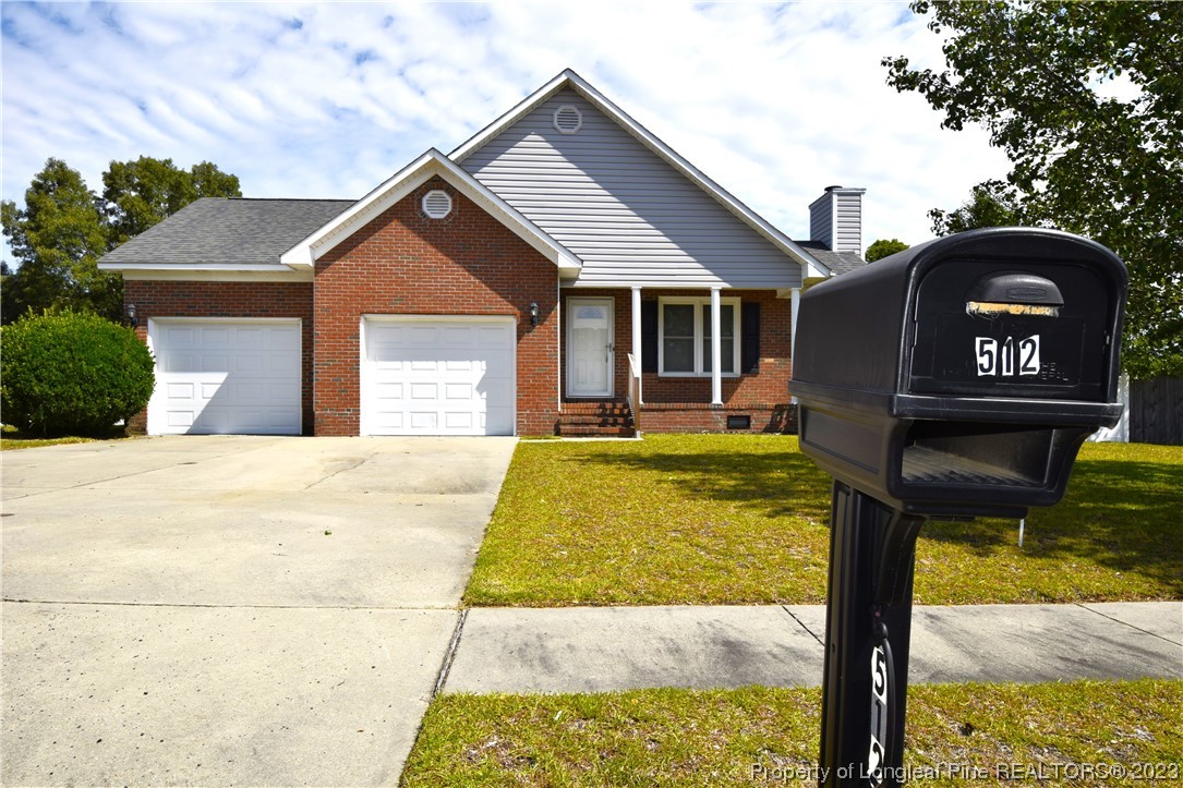 512 Kernstown Road Raeford, NC 28376 - Photo 2 of 25 a front view of a house with garden