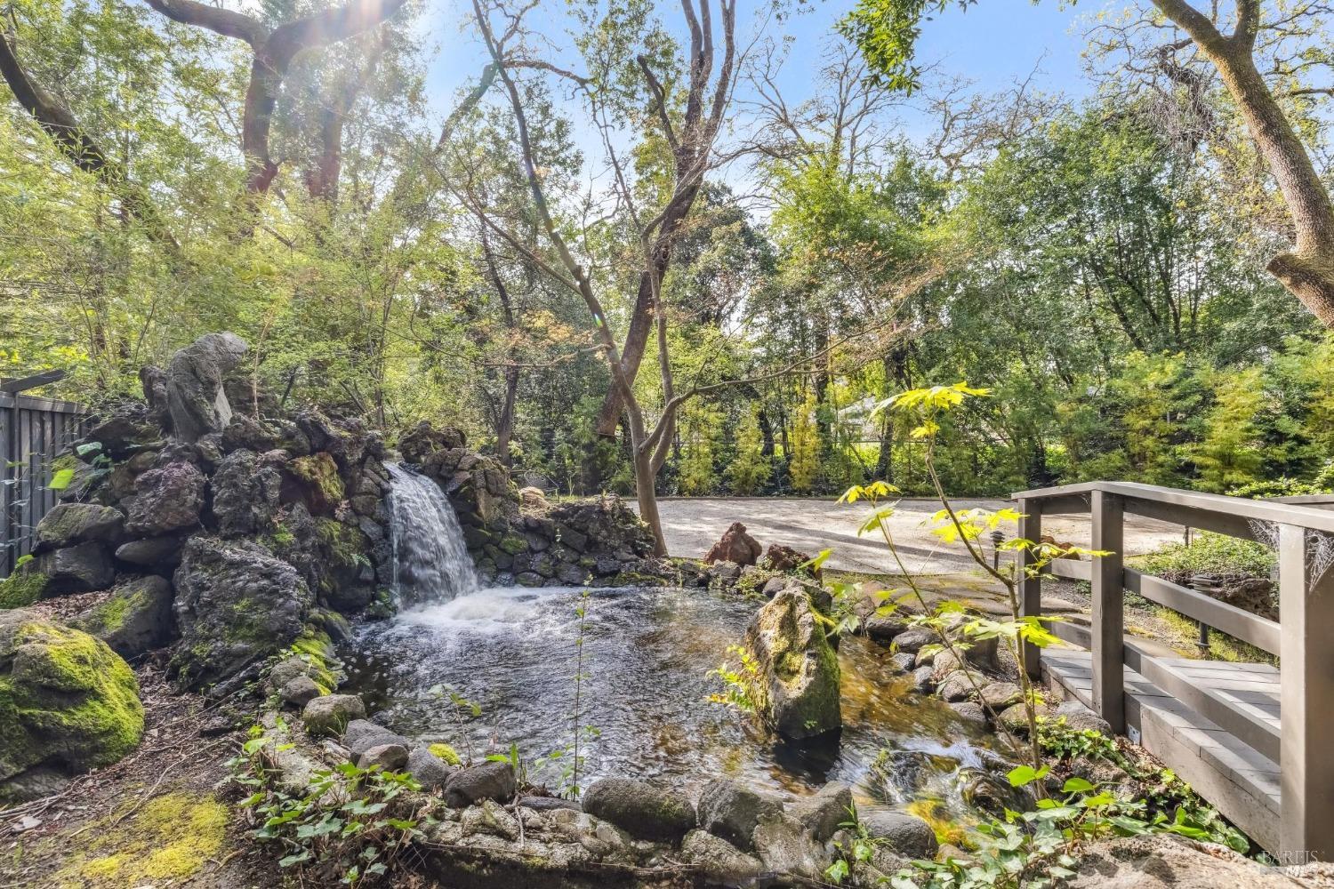 110 Mountain View Avenue San Rafael, CA 94901 - Photo 38 of 83 Stone Waterfall flowing into the pond fed by the on site well water