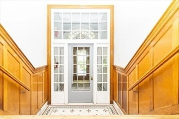 a view of a door and a window