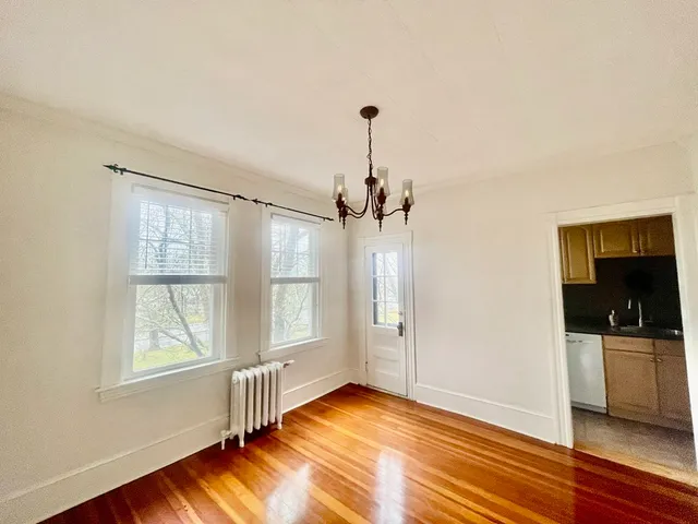 a kitchen with a sink a stove and cabinets