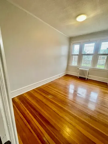 a view of a big room with wooden floor