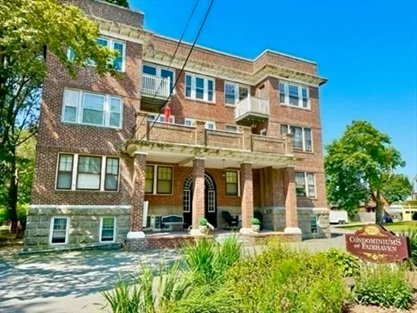 front view of a building with a yard