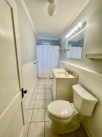 a view of a hallway with wooden floor and entryway