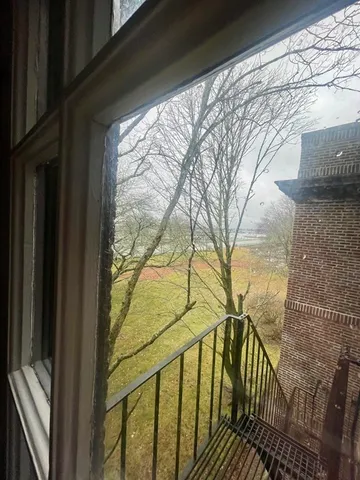 a view of a water fountain and a mountain