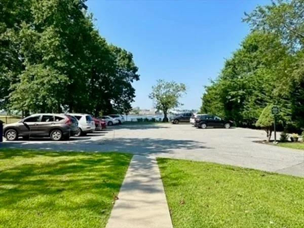 a view of yard with swimming pool and trees