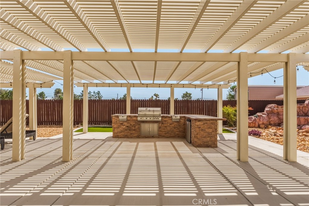 19501 Kinai Road Apple Valley, CA 92307 - Photo 40 of 49 a view of a swimming pool with a porch
