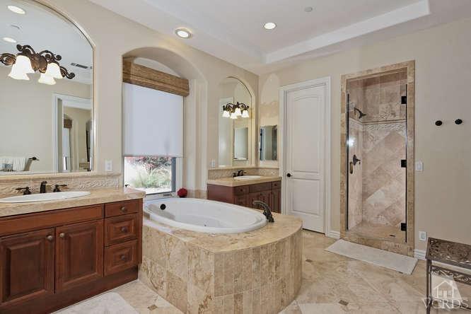 430 Sereno Place Camarillo, CA 93010 - Photo 15 of 33 a bathroom with a sink double vanity granite tub shower and a mirror