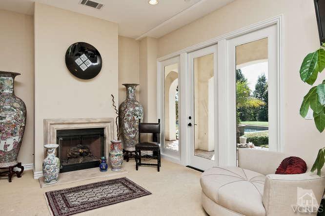 430 Sereno Place Camarillo, CA 93010 - Photo 16 of 33 a living room with furniture and a fireplace