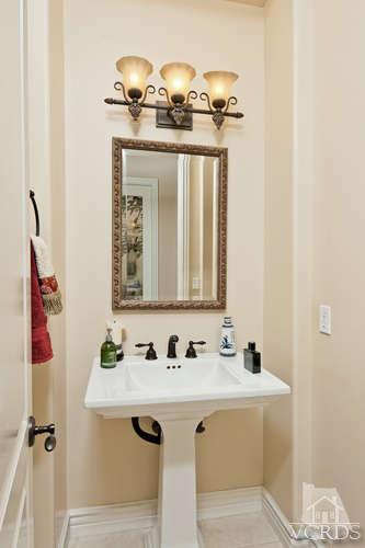 430 Sereno Place Camarillo, CA 93010 - Photo 23 of 33 a bathroom with a sink and a mirror